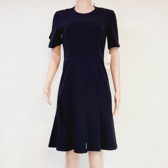 Donna Morgan Dresses & Skirts - Black dress- Donna Morgan, size 4. New with tags.